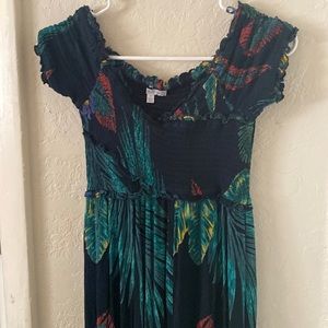 Women’s over the shoulder green pattern jumpsuit.